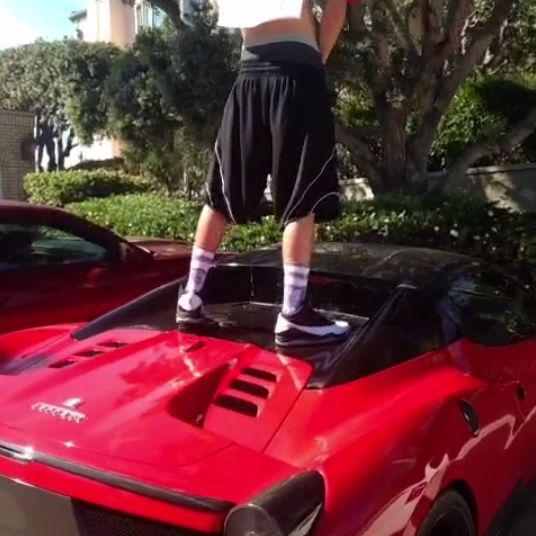 guy-standing-on-top-of-ferrari-458-spider-urinates-on-the-roof-video-95035_1.jpg.3007fecb3fd0eb857308484f9dd447f4.jpg
